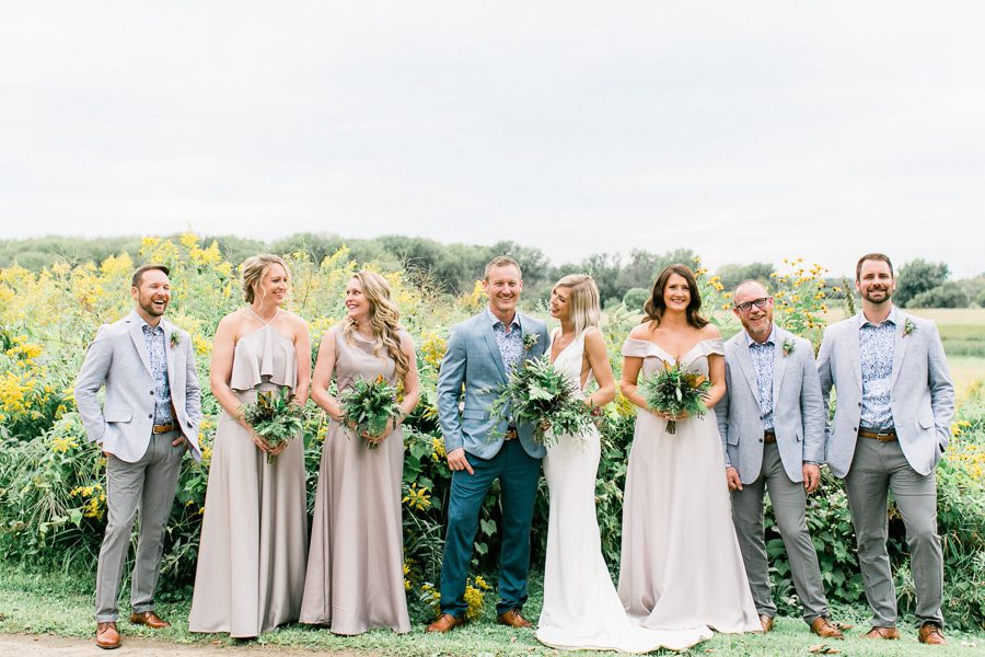 modern greenhouse wedding photos, carly mccray photography, lake geneva wedding photographer, madison wedding photographers, modern greenery wedding, modern wisconsin greenhouse wedding, modern greenery wedding, sleek wedding dress, greenery boutonnieres, black taper candles, green florals, modern greens