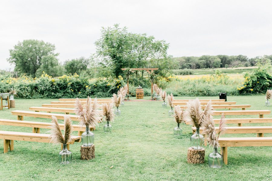 modern greenhouse wedding photos, carly mccray photography, lake geneva wedding photographer, madison wedding photographers, modern greenery wedding, modern wisconsin greenhouse wedding, modern greenery wedding, sleek wedding dress, greenery boutonnieres, black taper candles, green florals, modern greens