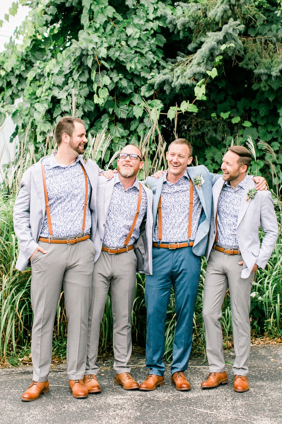 modern greenhouse wedding photos, carly mccray photography, lake geneva wedding photographer, madison wedding photographers, modern greenery wedding, modern wisconsin greenhouse wedding, modern greenery wedding, sleek wedding dress, greenery boutonnieres, black taper candles, green florals, modern greens