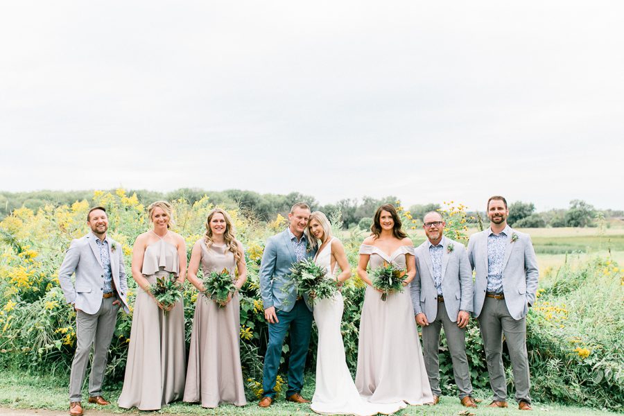 modern greenhouse wedding photos, carly mccray photography, lake geneva wedding photographer, madison wedding photographers, modern greenery wedding, modern wisconsin greenhouse wedding, modern greenery wedding, sleek wedding dress, greenery boutonnieres, black taper candles, green florals, modern greens